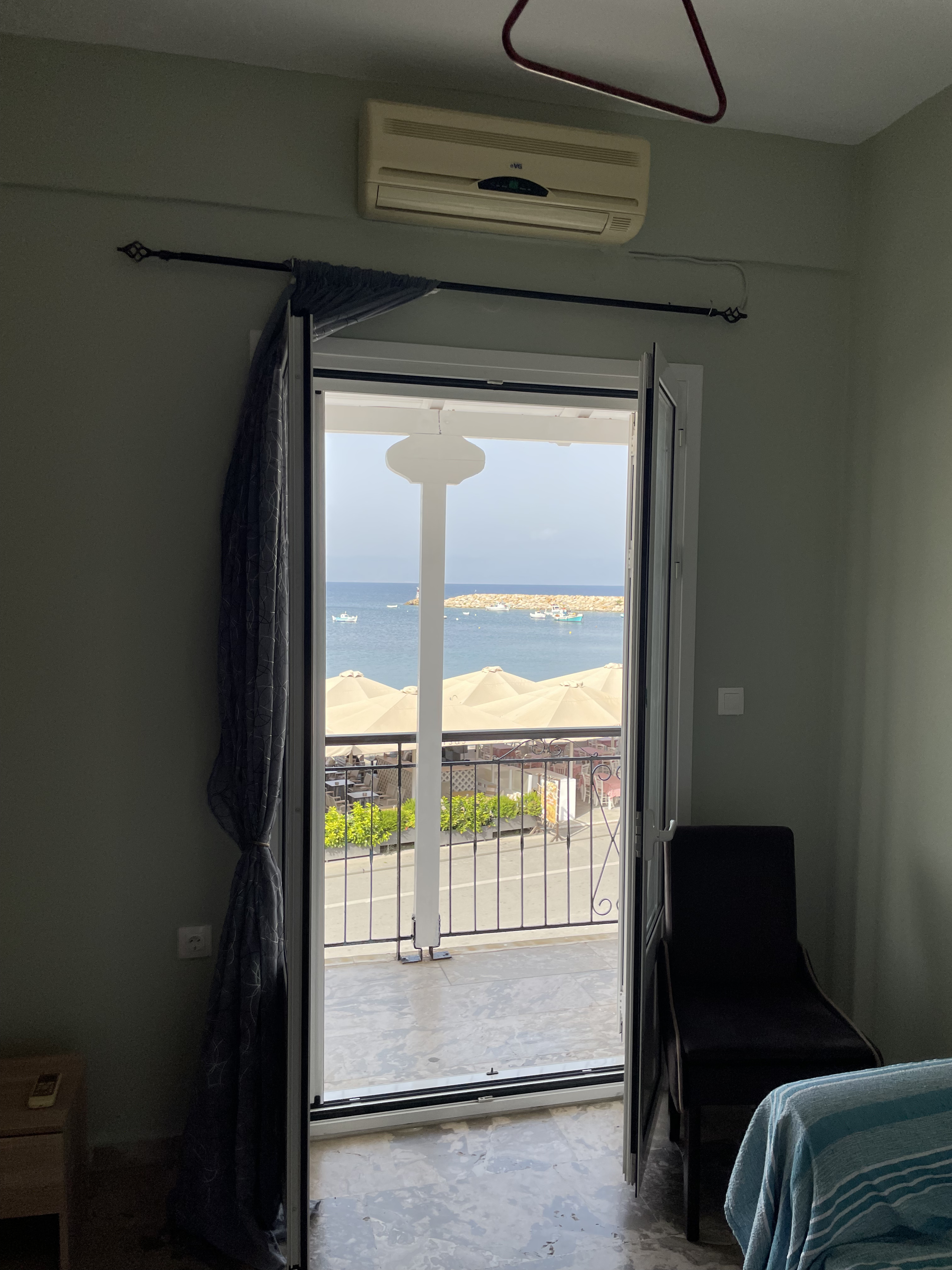 Bedroom door open to harbour balcony view