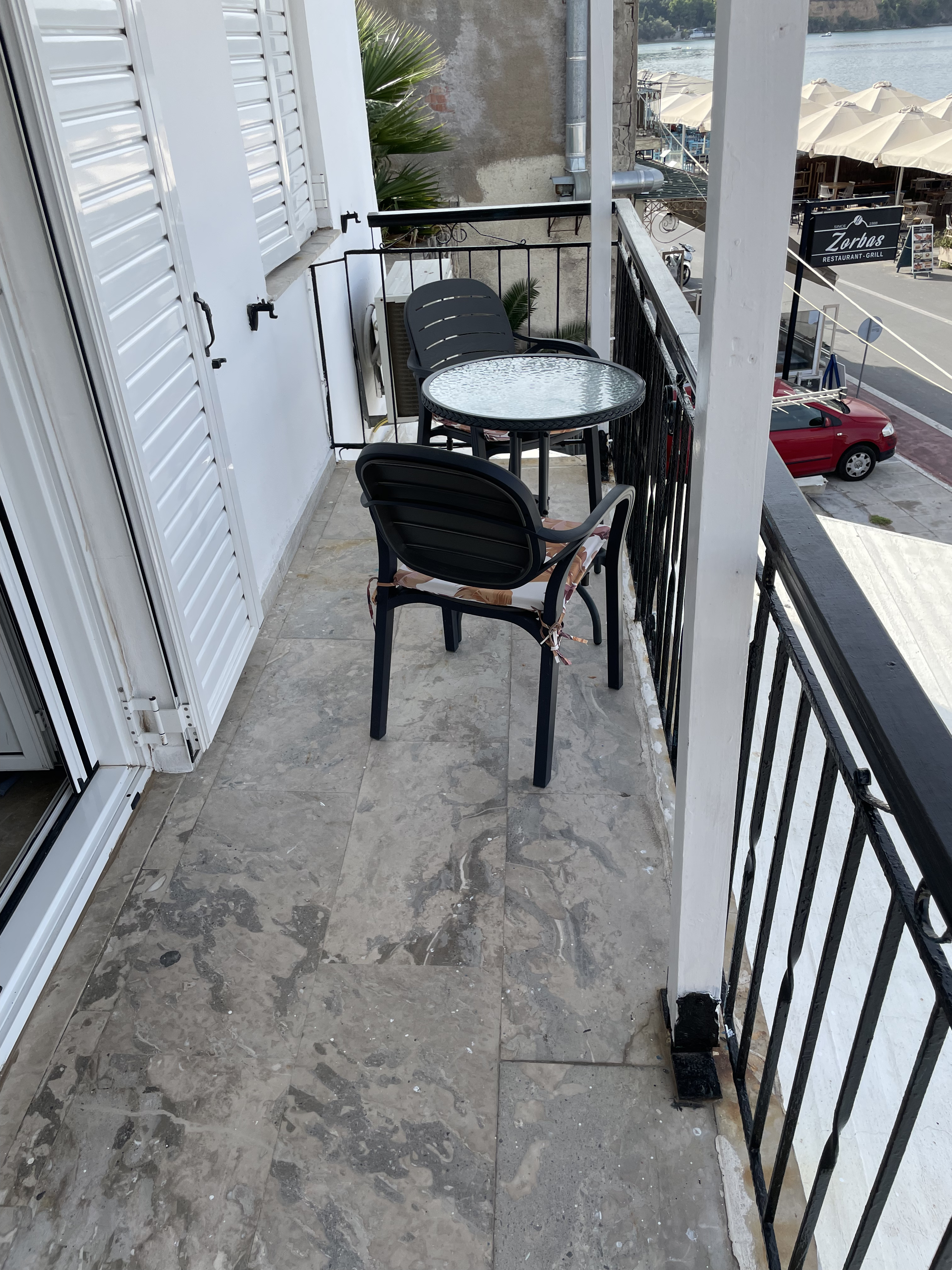 Balcony with table and chairs overlooking the harbour
