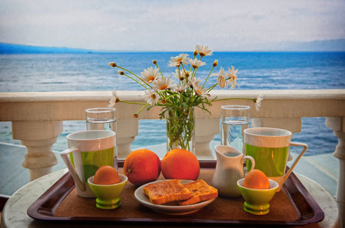 Breakfast tray on the balcony with sea view